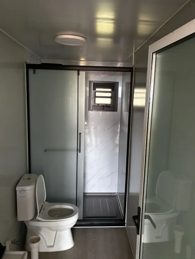 The bathroom and its shower cabin in the house in Paralia Kariani