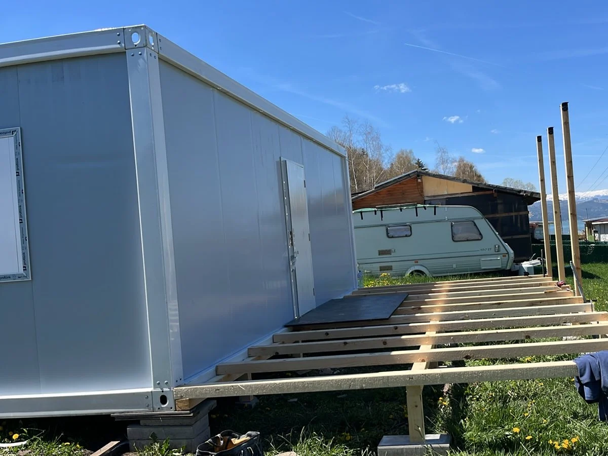 A container delivered to a customer's plot