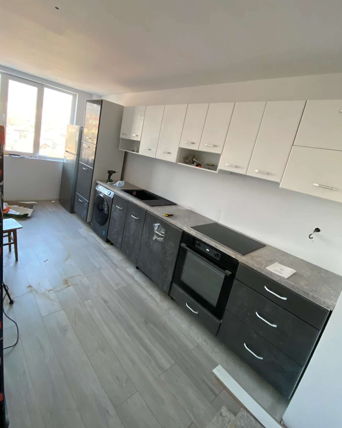 The same kitchen along its full length, after fitting